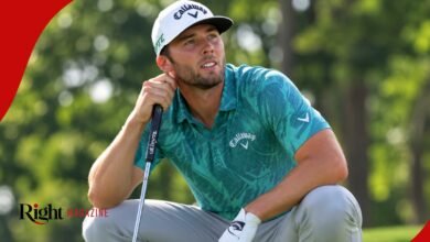 PGA Tour golfer Sam Burns squatting on the green, wearing a teal patterned Callaway polo and white cap while holding his putter.